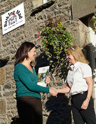 Photo of Lee welcoming a new dog volunteer