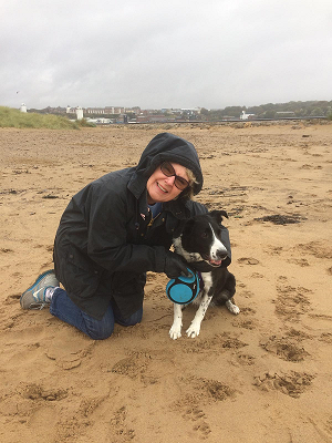 Brody black and white dog at the beach north east windy dog boarding barking mad sue seward
