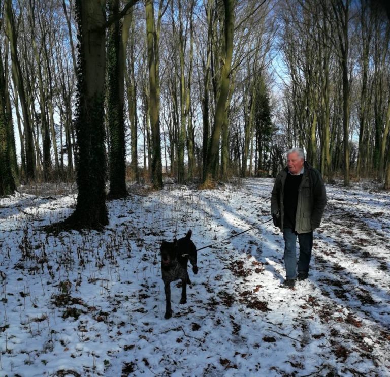 Host Adrian And Oscar The Pointer Taking A Snowy Walk In Oxfordshire Woodland. Barking Mad Oxfordshire dog sitting home boarding holiday