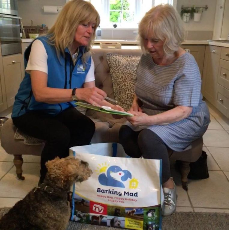 Jeannie Carrying Out A Registration With A New Customer Barking Mad Oxfordshire dog sitting home boarding holiday