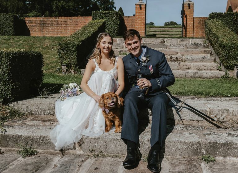 Bride and Groom with their dog at their wedding